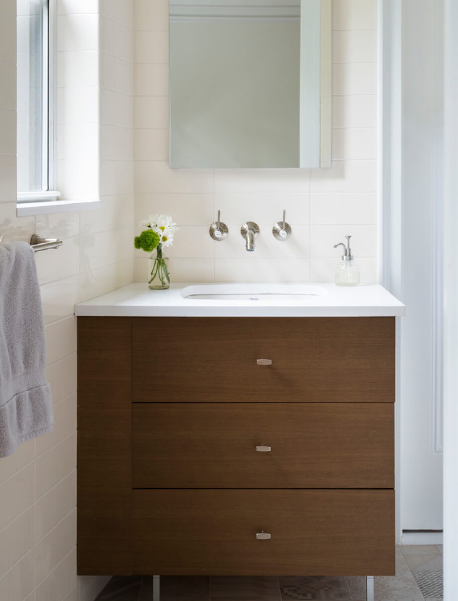Small bathroom with a floating vanity and a large window